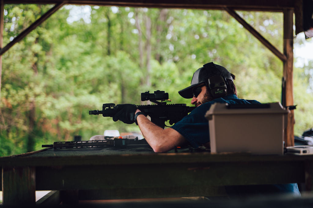 Shooter using Strikeman training equipment at an outdoor range